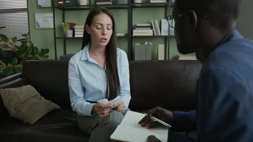 Upset Woman with Napkin Complaining about Problem to Male Counsellor