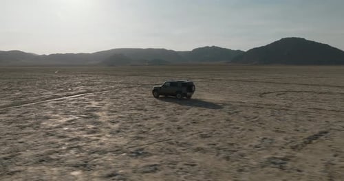 a car driving through a desert