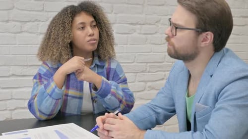 Business Professionals Collaborating on Documents in the Office