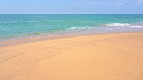 Slow-motion wave breaking on the beach.