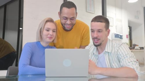 Young Adults Discussing Project in Modern Office