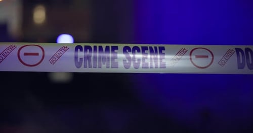 Crime Scene Tape at Night with Flashing Lights