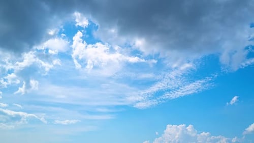 Clouds Drifting in Bright Blue Sky