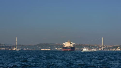 As an Oil Tanker Advances Through the Bosphorus Strait Its Enormity Contrasts with the Narrow