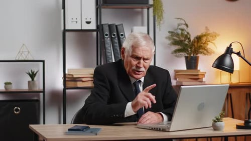 Senior Businessman Working on Laptop at Home Office Desk Talk on Online Communication Video Call