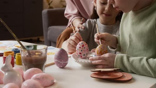 Little Girls Decorating Easter Eggs with Gouache Paint
