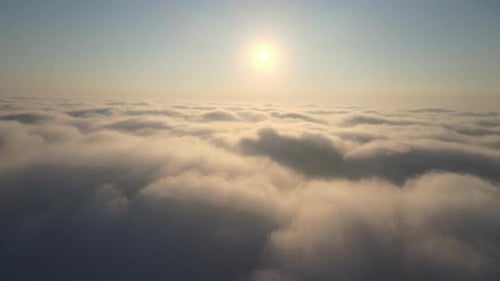 Aerial View Above Clouds During Golden Hour