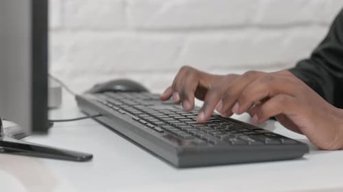 Close-up of Businessman Hands Typing on Keyboard