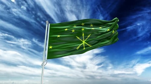 Realistic Waving Green Flag Against a Blue Sky