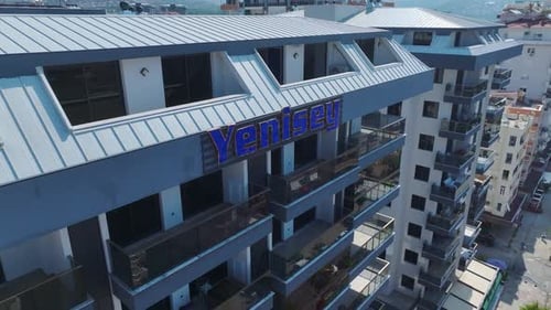 Aerial View Completed Residential Complex With a Large Pool and Water Slides By the Sea