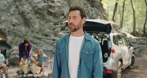 Smiling Man on a Family Road Trip in Nature