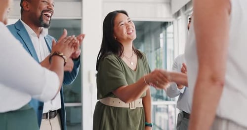 Diverse Team Celebrates Success in Bright Office