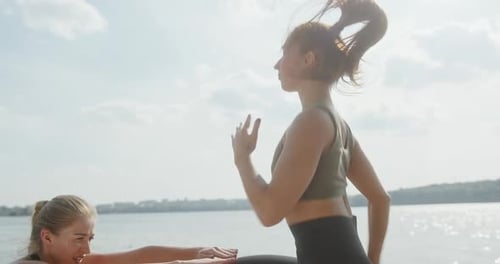 Two Women Exercising Outdoors on Sunny Day