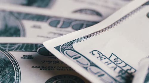 American Money Dollars on Rotating Surface Background