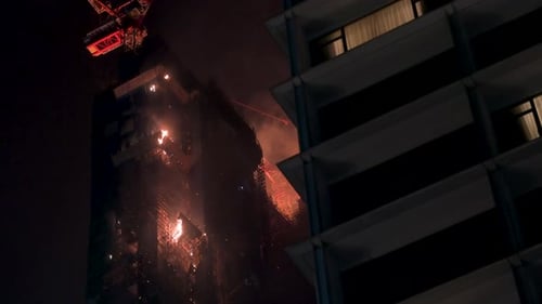 A fire breaks out in a high-rise skyscraper office building under construction in Hong Kong.