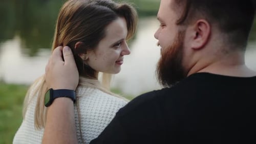 Romantic Moment By the Lake Young Couple in Love Sharing an Intimate Glance