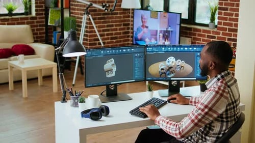 African American Industrial Designer Works on Prototypes in a Creative Studio