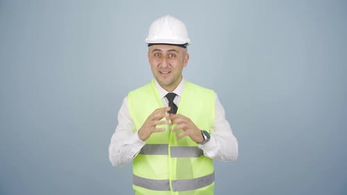 Engineer making a sign of confidence at the camera.