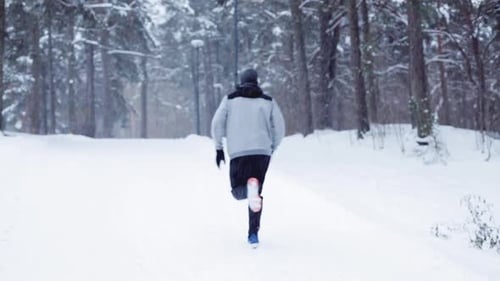 Fitness, Sport, People, Season and Healthy Lifestyle Concept - Young Man Running