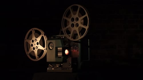 Vintage Film Projector Illuminates Dark Cinema Setting