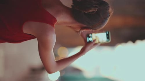 Close-up, girl takes pictures of downtown mobile phone