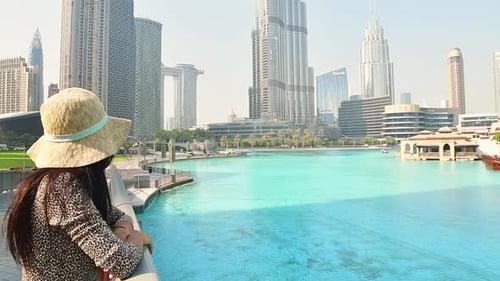 Woman In Hot Day In Dubai By Burj Khalifa