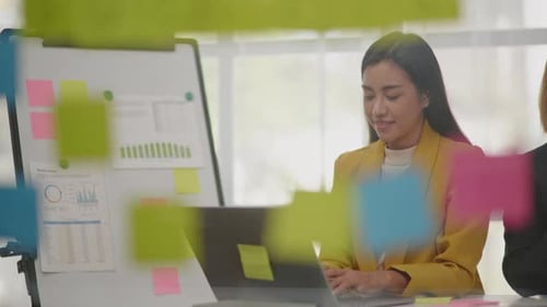 Women Working on Laptop in Bright Modern Office