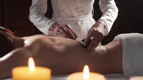 Young Healthy and Beautiful Woman Gets Massage Therapy in the Spa Salon The Concept of Healthy