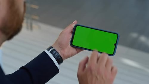 Office Worker Tapping Chroma Key Cellphone at Work Break Closeup Unknown Man