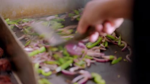 Restaurant Kitchen Scene with Vegetables Being Cooked