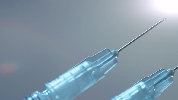 Two syringes for both doses of the Covid-19 vaccine - close up sliding ...