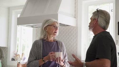Senior Couple Chatting over Coffee