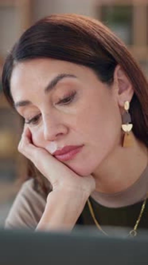 Bored, laptop and problem solving with business woman at desk in office for administration