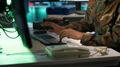 Army Specialist Overseeing National Safety Operations with Devices Close Up
