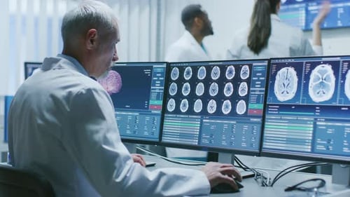 Medical Professionals Analyzing Brain Scans in Modern Lab