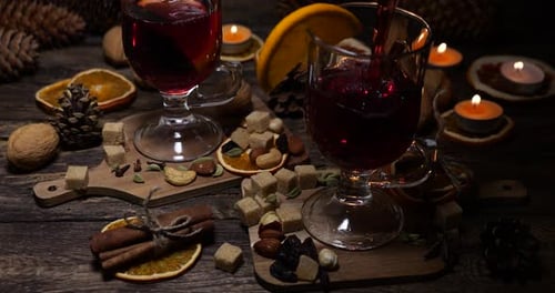 Mulled Wine Ingredients With Wine Being Poured