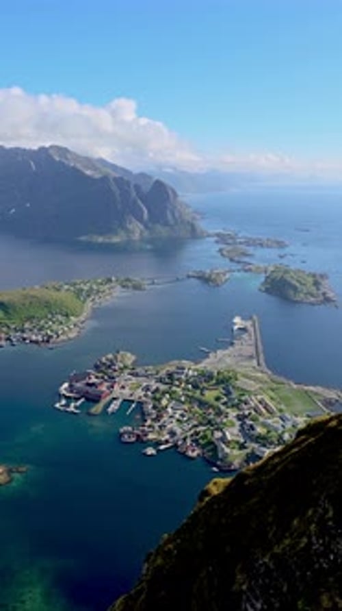 Aerial View of a Small Island Town with Mountains and waterReinebringen Lofoten Norway