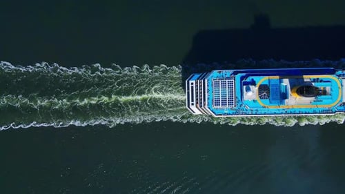Aerial View Top Down a Cruise Ship Sails Through Ocean