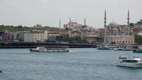 Istanbul cityscape with boats on the Bosphorus and historical mosque backgrounds