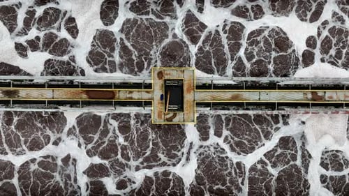 Swirling Water in Pools with Bridge at Treatment Station