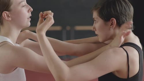 Two Women Practicing Arm and Hand Movements