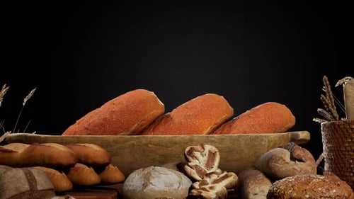 Rustic Bakery Bread and Wheat on Black Background