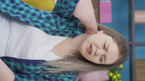 Woman Massaging Neck Due to Muscle Strain