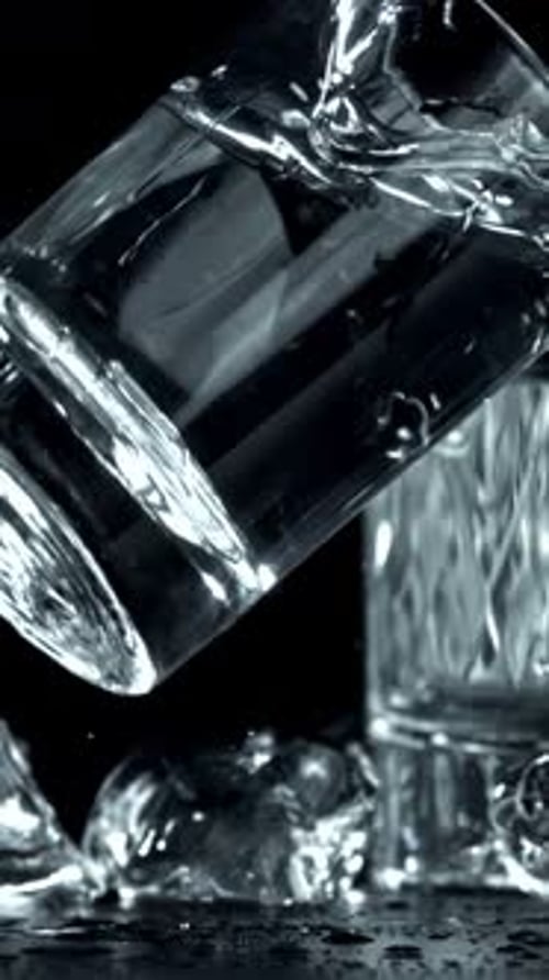 Vodka in a Glass Falls on the Table Filmed on a Highspeed Camera at 1000 Fps