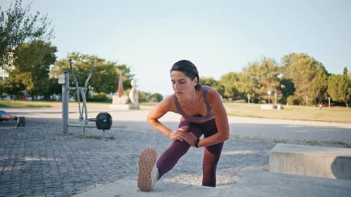 Focused Runner Warming Legs Up City Stadium Woman Stretching Muscles Outdoors