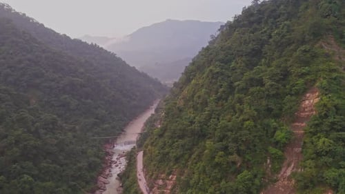 River Flowing Between Two Mountains – Scenic Valley Landscape with Green Hills and Nature
