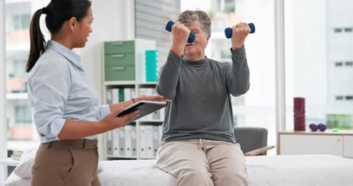 Senior Woman Doing Physical Therapy with Dumbbells