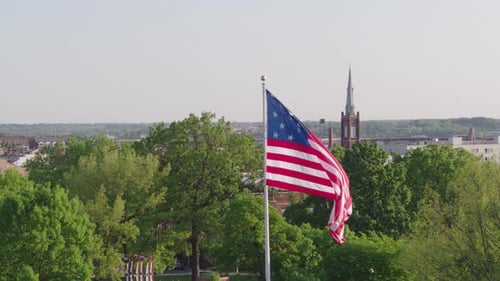 American Flag Waving in Urban Setting Daytime