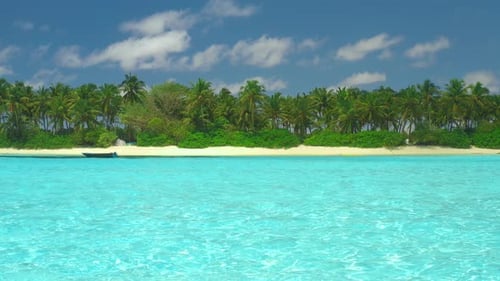 Beautiful View to a Tropical Island in the Maldives with Turquoise Sea Fine Sand and Coconut Palm