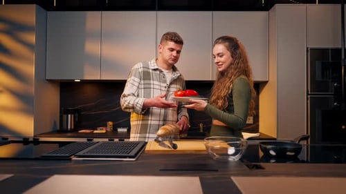 Young Couple Prepares Food in Modern Kitchen